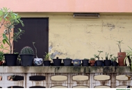 wall has potted plants on top.